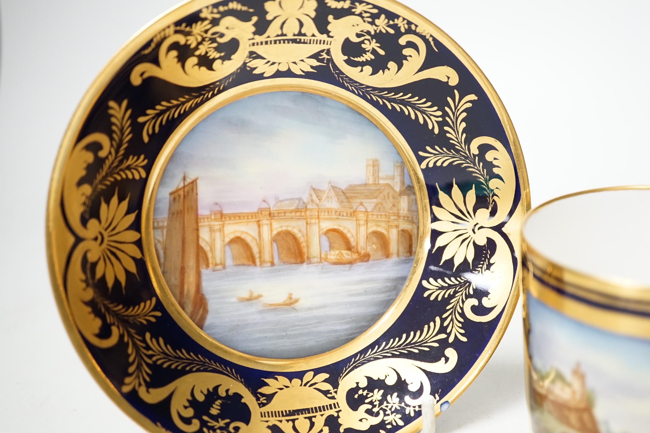 A Continental Derby style cup and saucer, 8cm tall overall